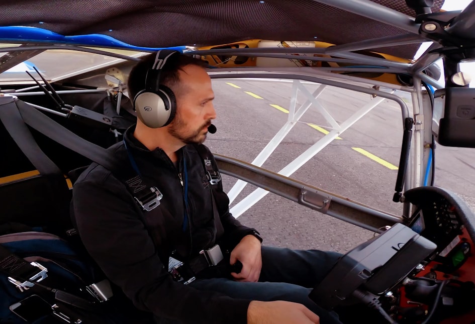 Pilot in cockpit with headset